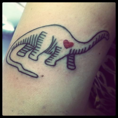 Small red heart and dinosaur tattoo