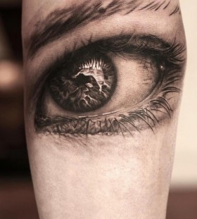 3D black eye tattoo on arm