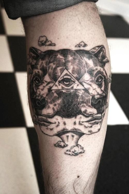 3D eyes and bear tattoo on arm