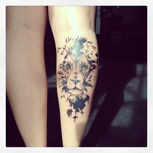 Adorable black lion tattoo on leg