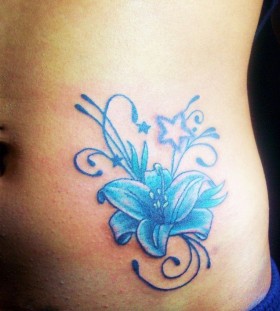 Adorable blue star and flower tattoo