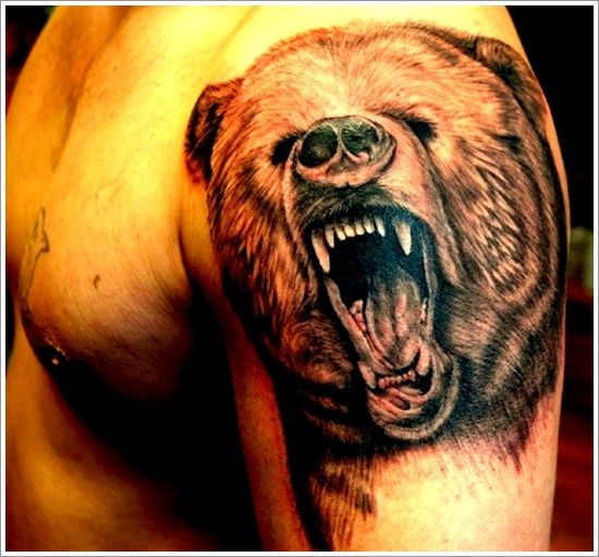 Adorable brown bear tattoo on arm