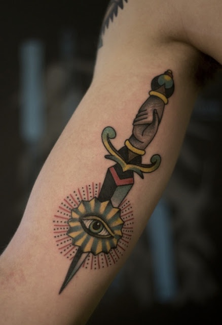 Adorable knife and eye tattoo on arm