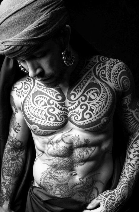 Adorable men’s black tribal tattoo on arm