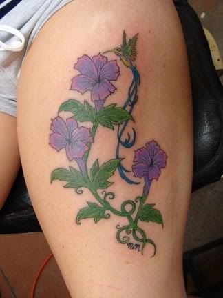 Adorable purple flower tattoo on leg