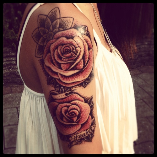 Adorable red rose tattoo on arm