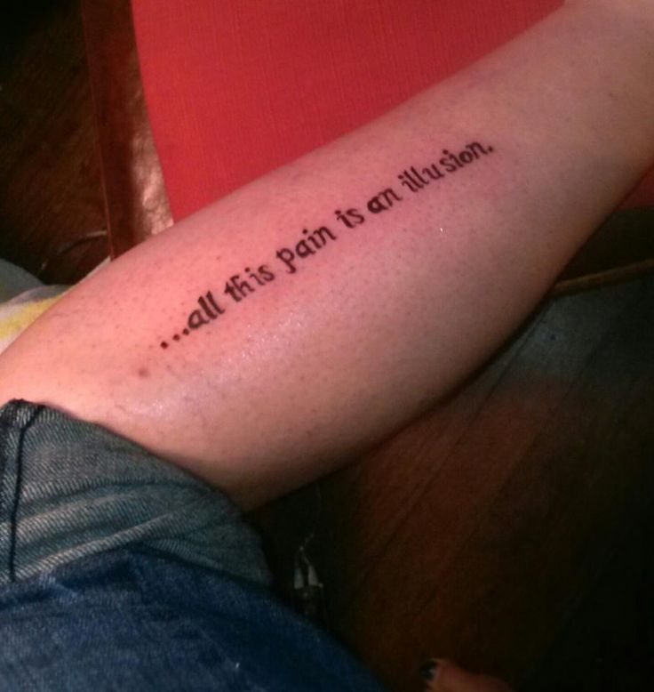 All this pain is an illusion quote tattoo on leg