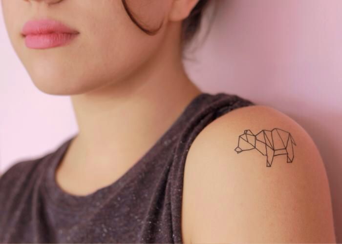 Amazing black bear origami tattoo on shoulder