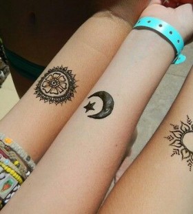 Amazing black sun tattoo on arm