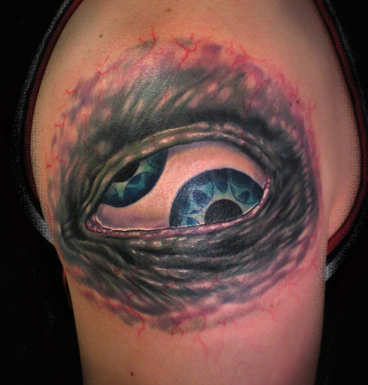Amazing blue eyes tattoo on shoulder