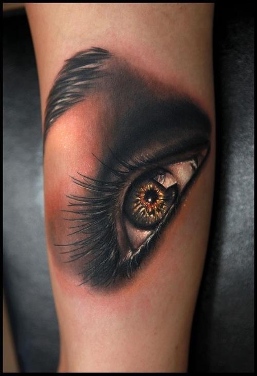 Amazing green eye tattoo on arm