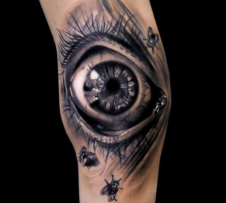 Amazing insect eye tattoo on leg