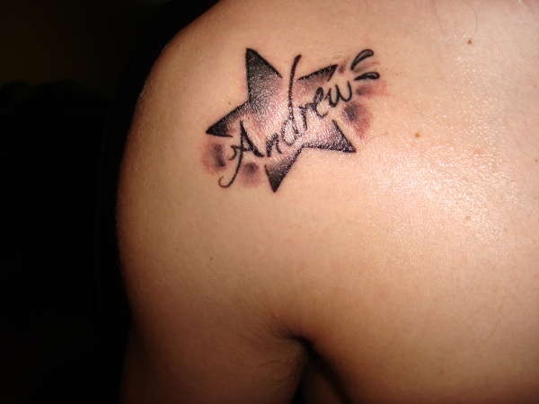 Andrew name and star tattoo on shoulder