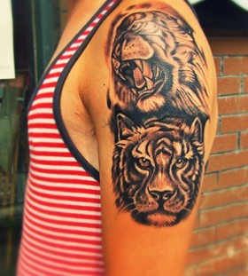 Angry and smart tiger tattoo on arm