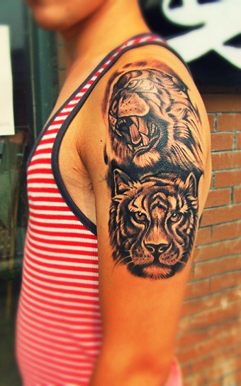 Angry and smart tiger tattoo on arm