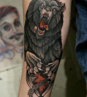 Angry black bear tattoo on arm