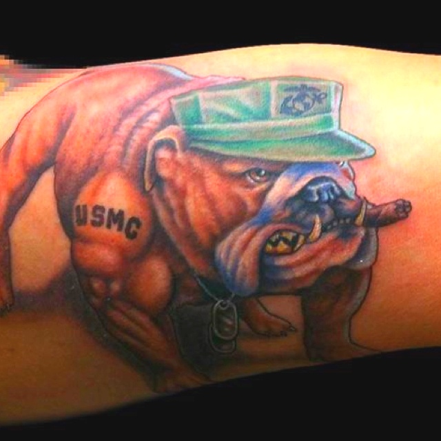 Angry dog tattoo on arm with green cap