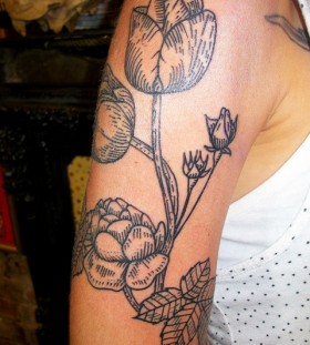 Awesome black tulips tattoo