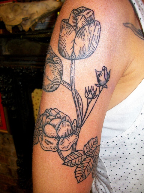 Awesome black tulips tattoo