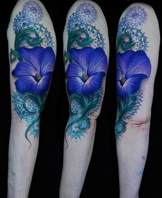 Awesome blue flower tattoo on hand