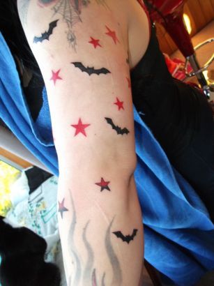 Awesome flyingmouse star tattoo on arm