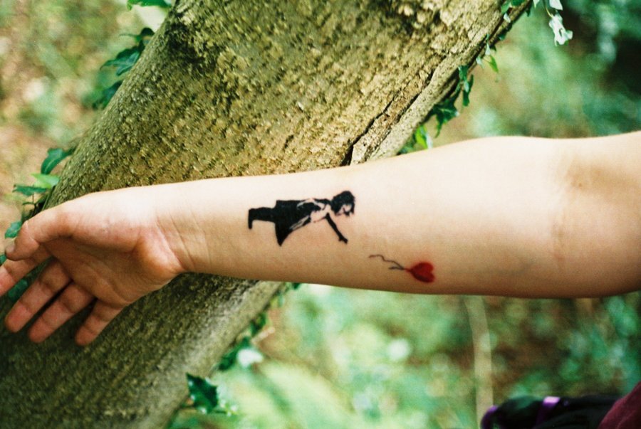 Bansky tattoo on hand