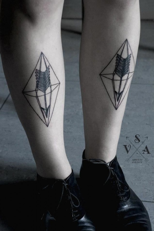 Black and white crystal tattoo on leg