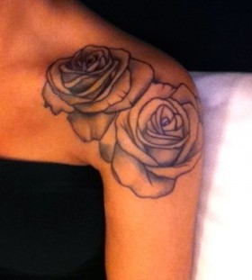 Black and white rose tattoo on shoulder