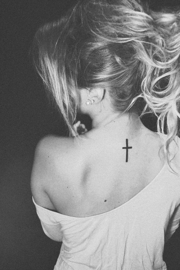 Black and white style back cross tattoo