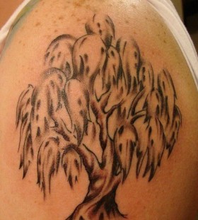 Black and white tree tattoo on shoulder