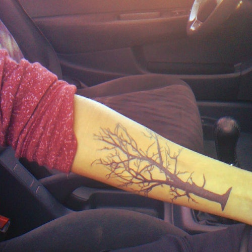 Black awesome tree tattoo on arm