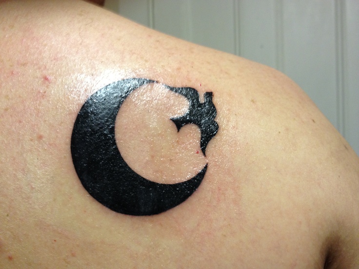 Black bird and black moon tattoo on shoulder