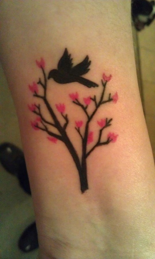 Black bird cherry tattoo on arm