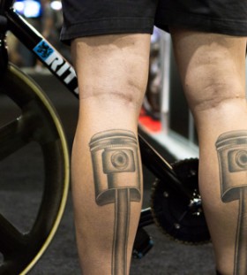 Black design of bicycle tattoo on leg