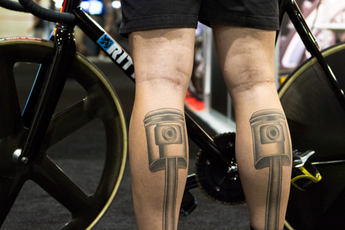 Black design of bicycle tattoo on leg