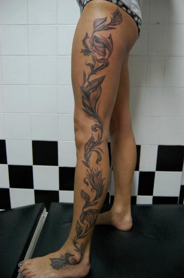 Black flower tattoo on leg