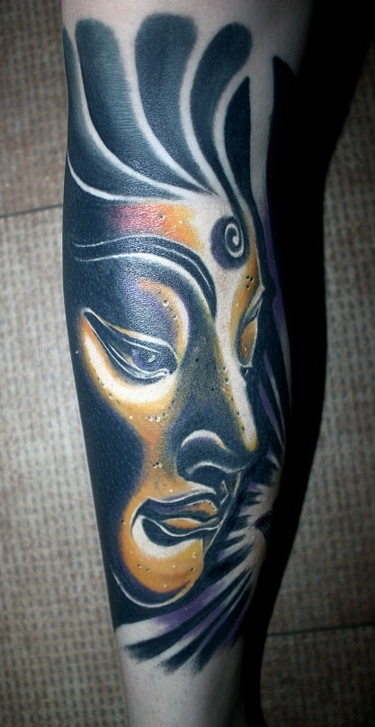 Black girl face tattoo on leg