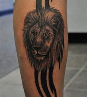 Black lines and lion tattoo on leg