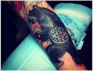 Black lovely bear tattoo on arm