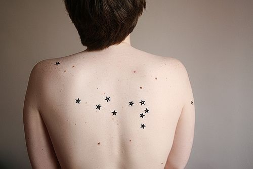 Black lovely girl star tattoo on arm