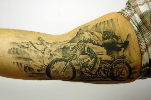 Black men’s and bicycle tattoo on arm