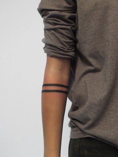 Black men’s line tattoo on arm