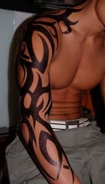 Black men’s tribal tattoo on arm