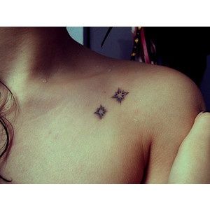 Black mini star tattoo on shoulder