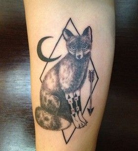 Black moon and wolf tattoo on leg