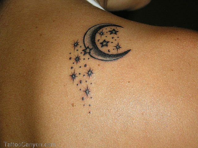 Black moon star tattoo on shoulder