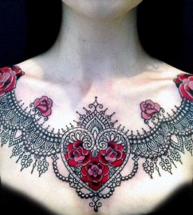 Black ornaments and red heart flower tattoo on chest