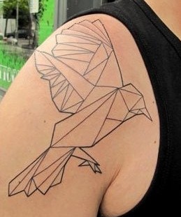 Black ornaments of origami tattoo on shoulder