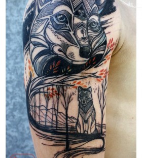 Black ornaments wolf tattoo on arm