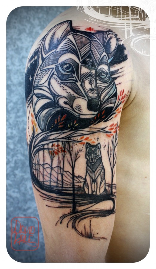 Black ornaments wolf tattoo on arm